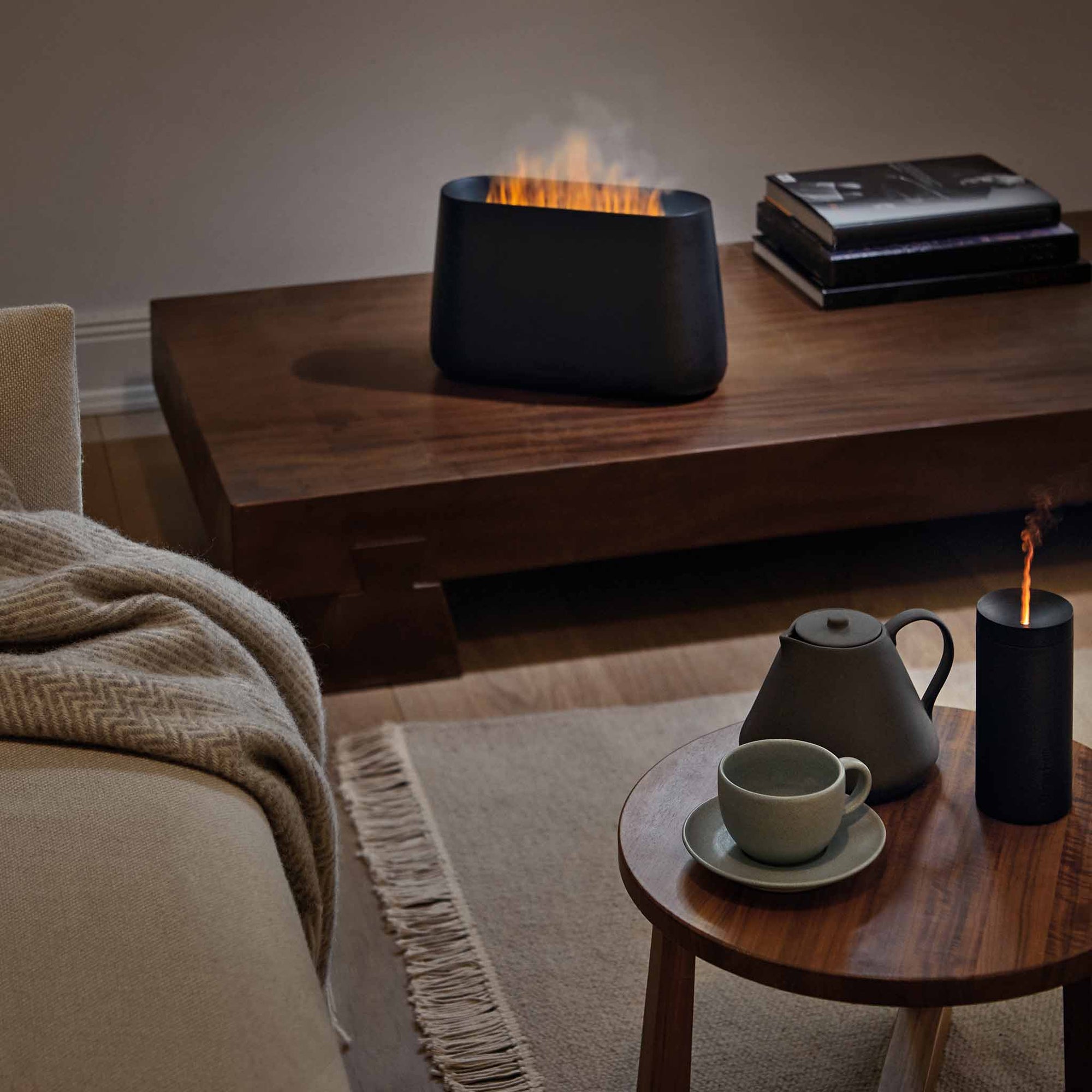 Stadler Form's BEN humidifies and scents the air in the room while bathing it in the amber light of the fireplace effect.